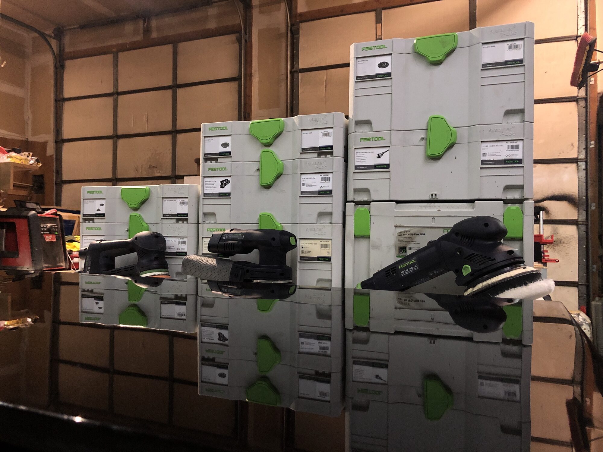 Festool sanders reflected in the mirror-finished surface — the image Festool reposted